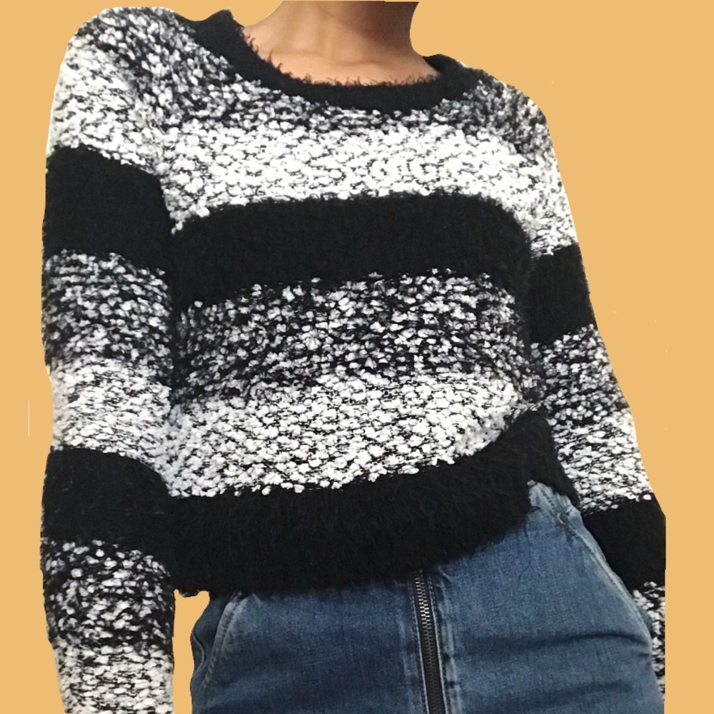 Cropped fuzzy black and white striped sweater.